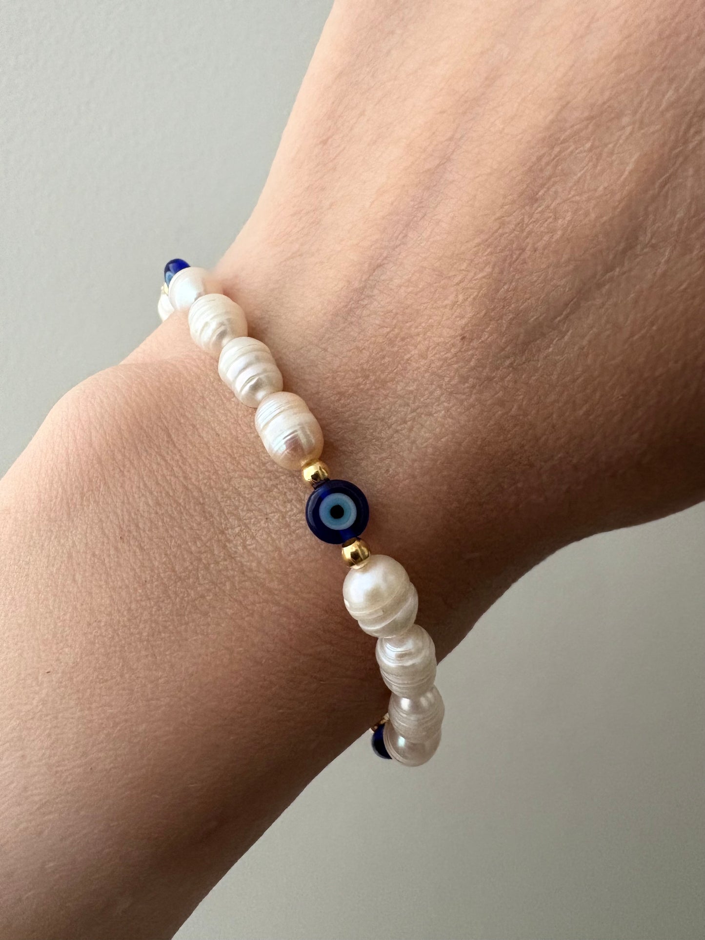 Pearl and evil eye bracelet