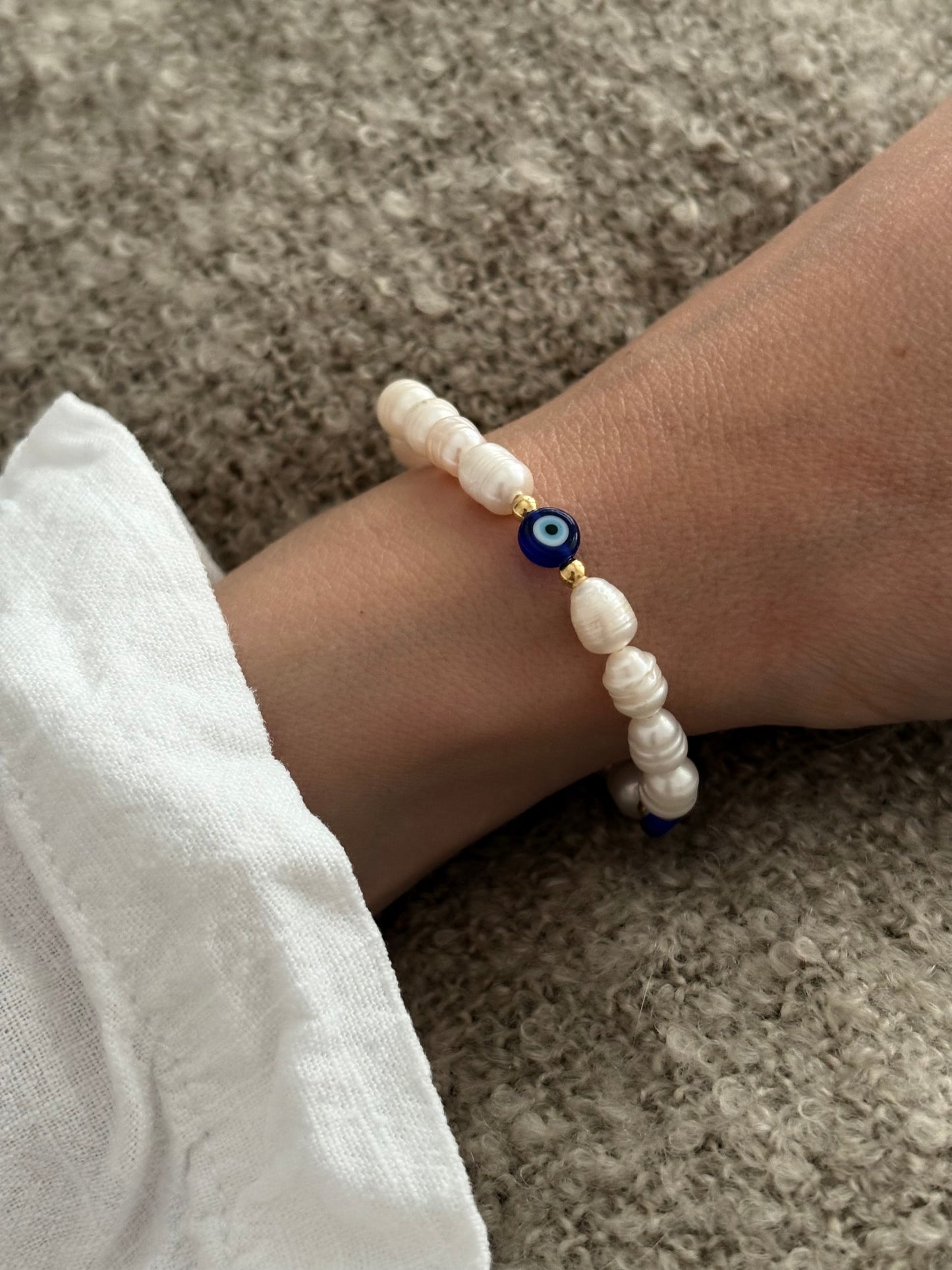 Pearl and evil eye bracelet